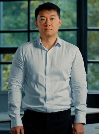 Portrait strong male asian professional boss businessman motivated korean japanese employer leader standing in modern office company posing with folded arms thinking business plan motivation concept. High quality 4k footage